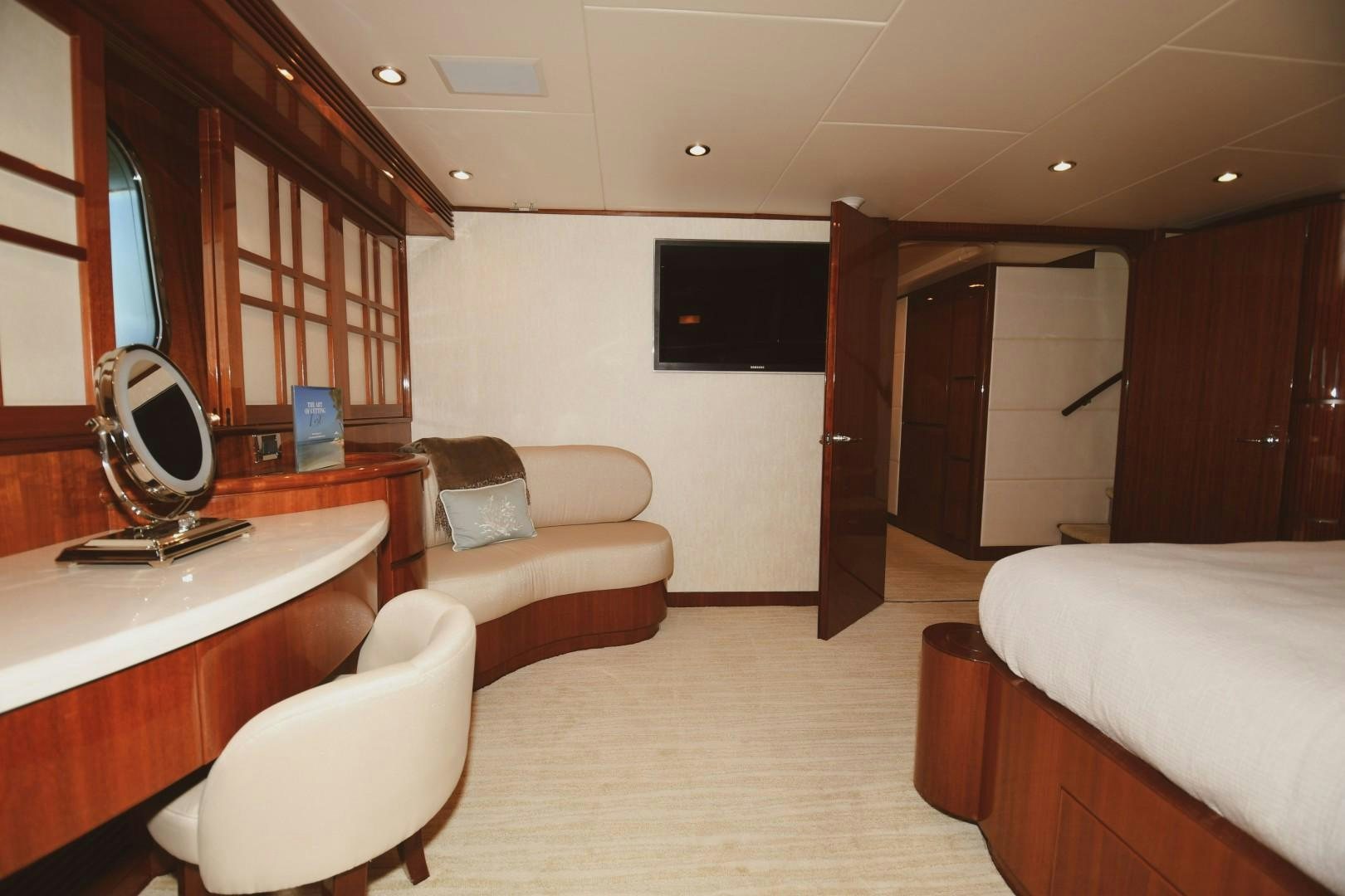 a room with a bed and a desk aboard WARHORSE Yacht for Sale