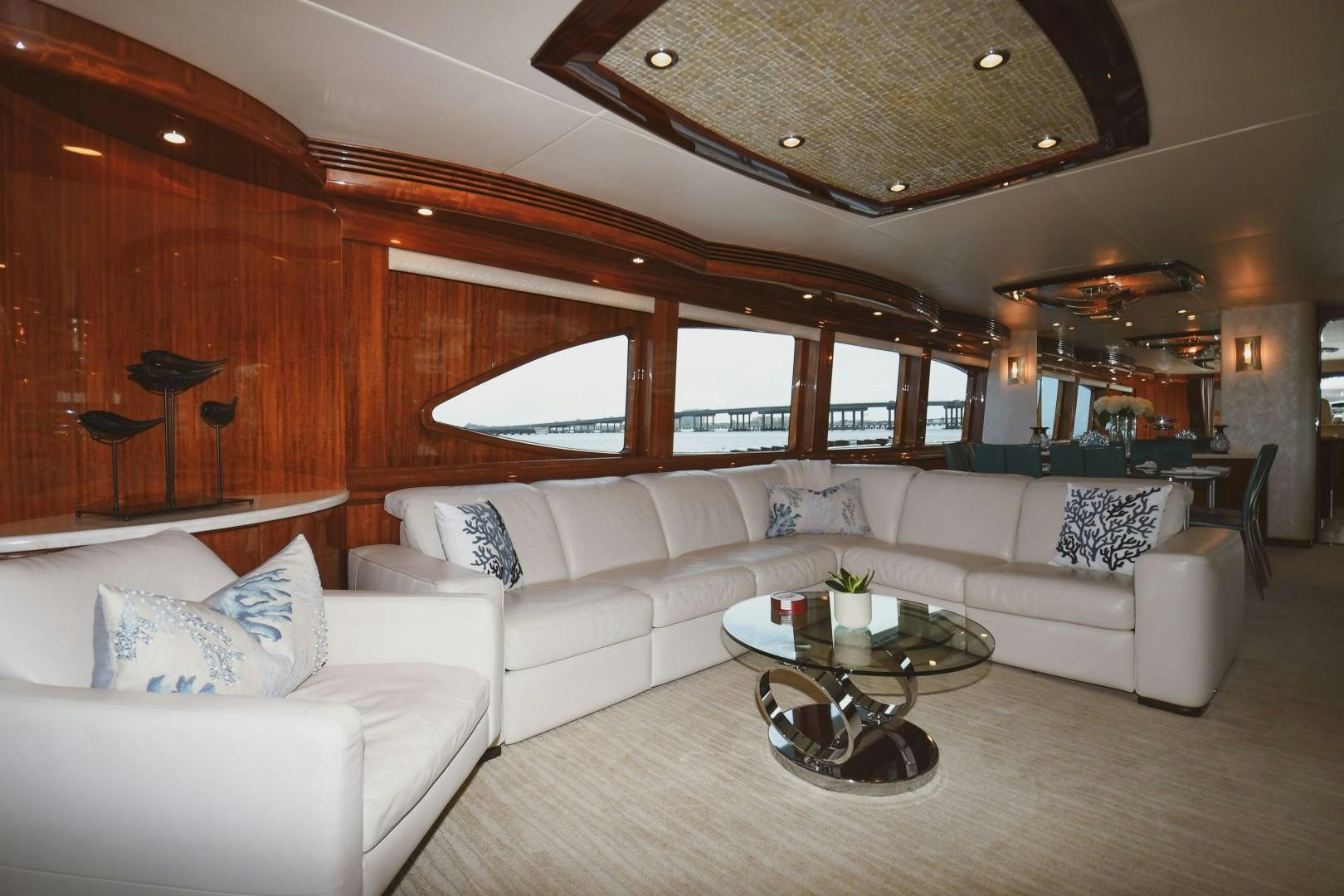 a living room with a couch and a table aboard WARHORSE Yacht for Sale