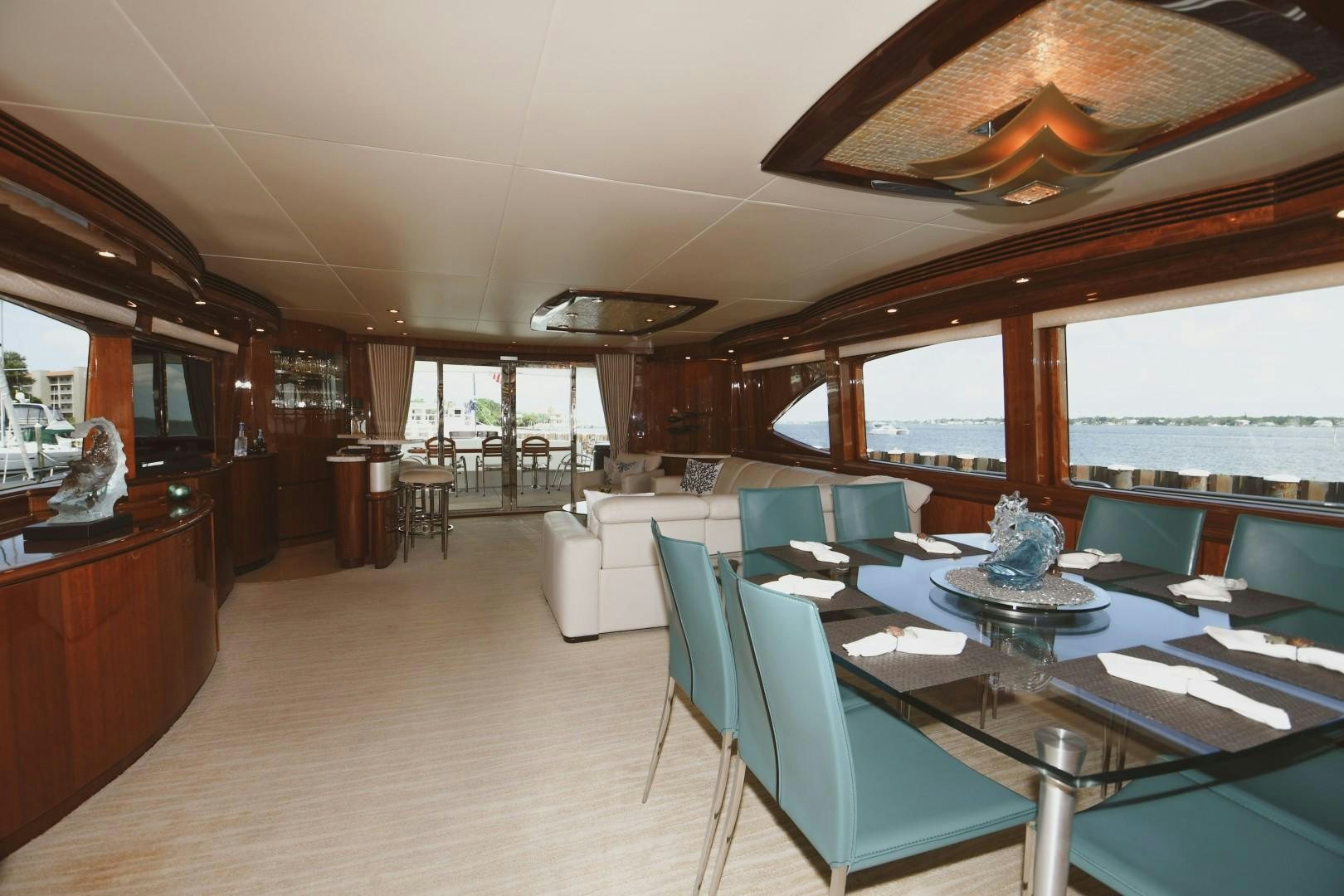 a room with a table and chairs aboard WARHORSE Yacht for Sale