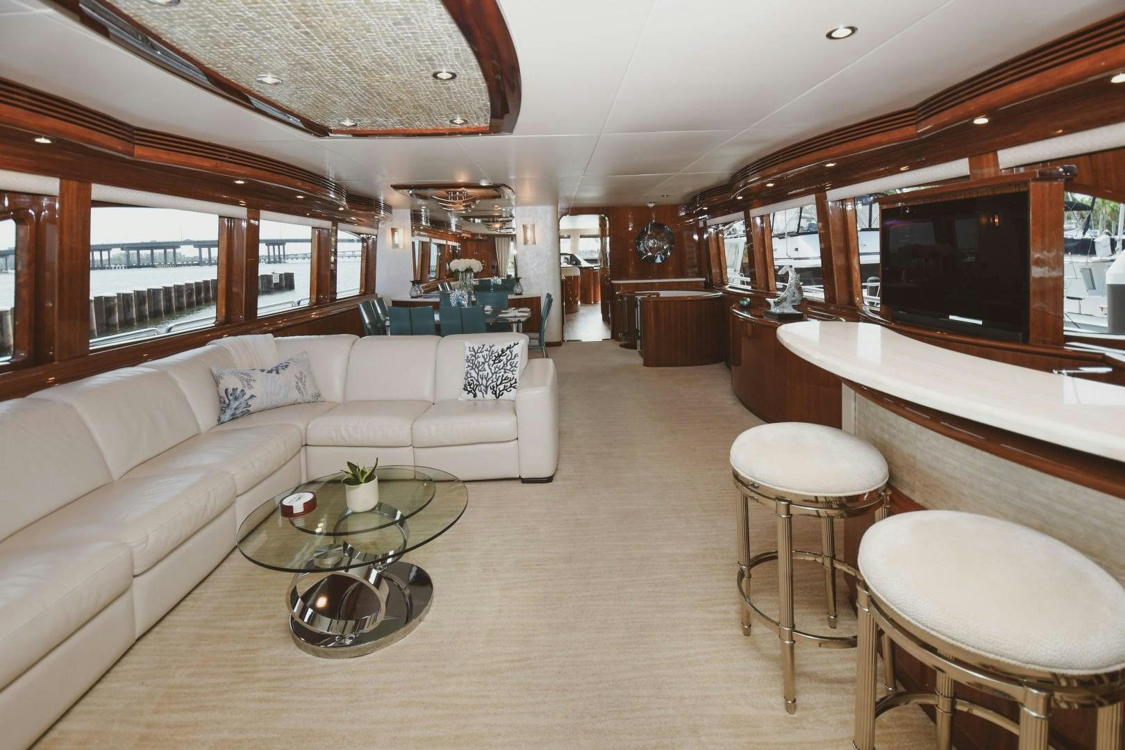 a living room with a couch and a television aboard WARHORSE Yacht for Sale