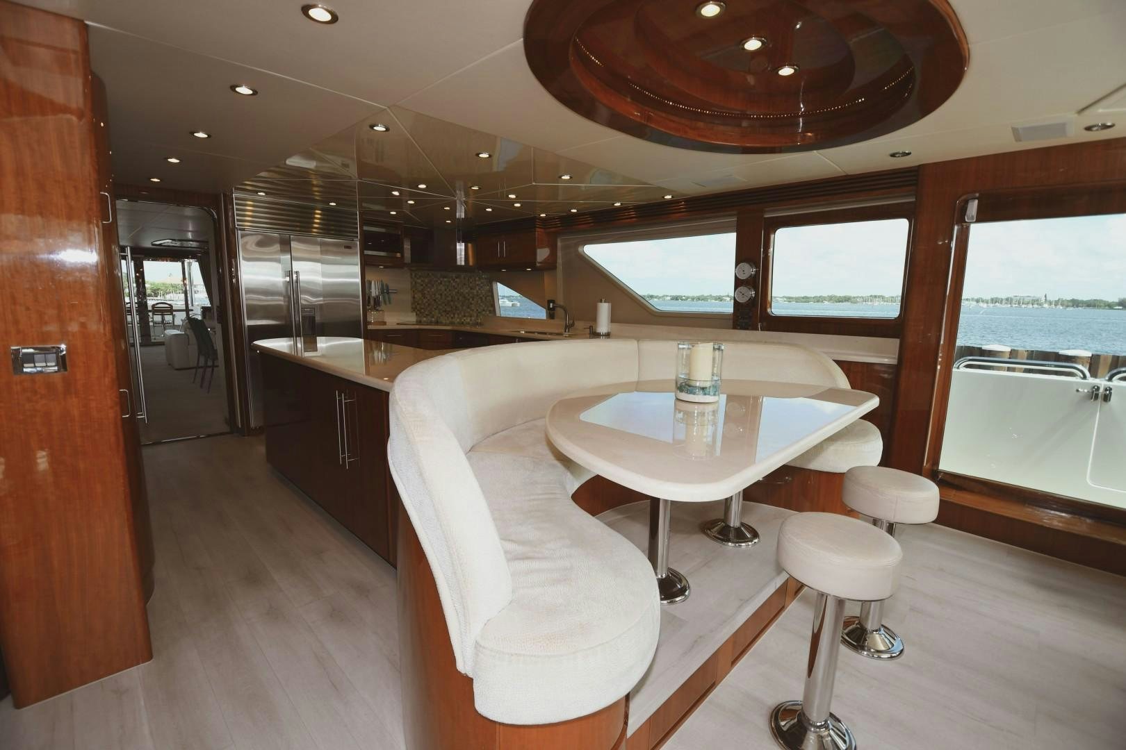 a room with a table and chairs aboard WARHORSE Yacht for Sale