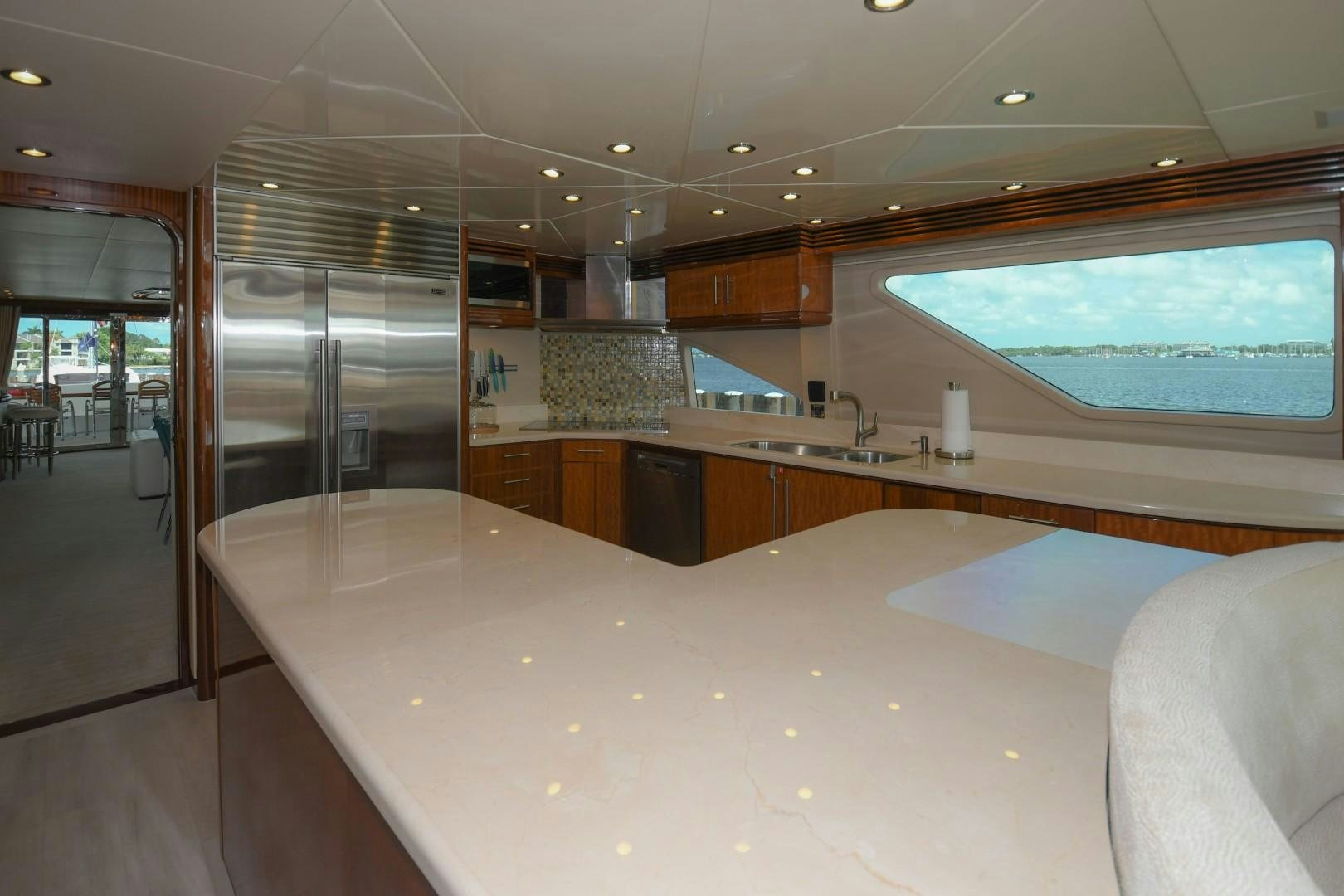 a large kitchen with a large window aboard WARHORSE Yacht for Sale