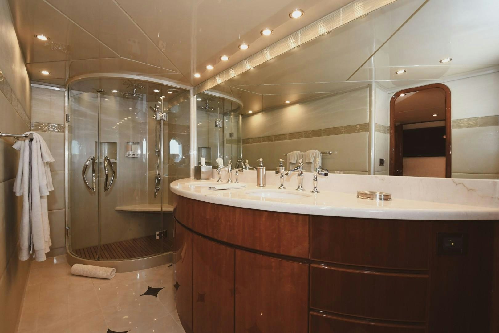 a bathroom with a glass shower aboard WARHORSE Yacht for Sale