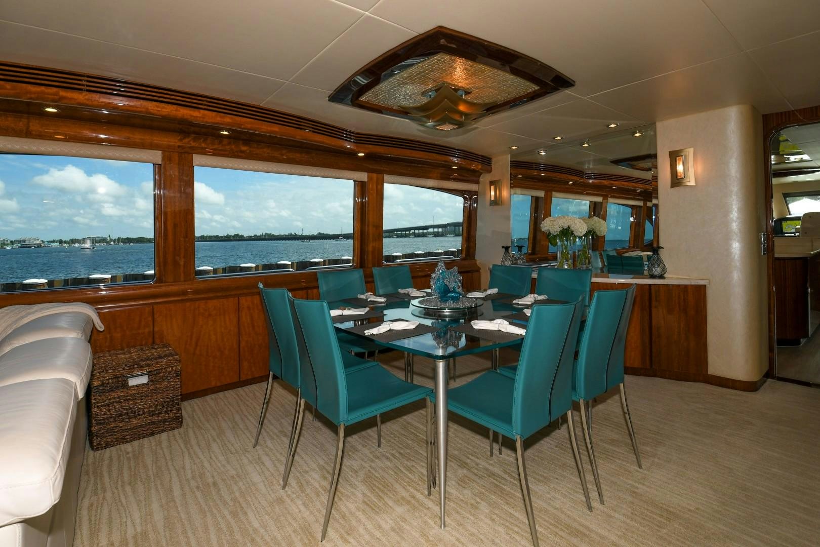 a table and chairs in a room aboard WARHORSE Yacht for Sale