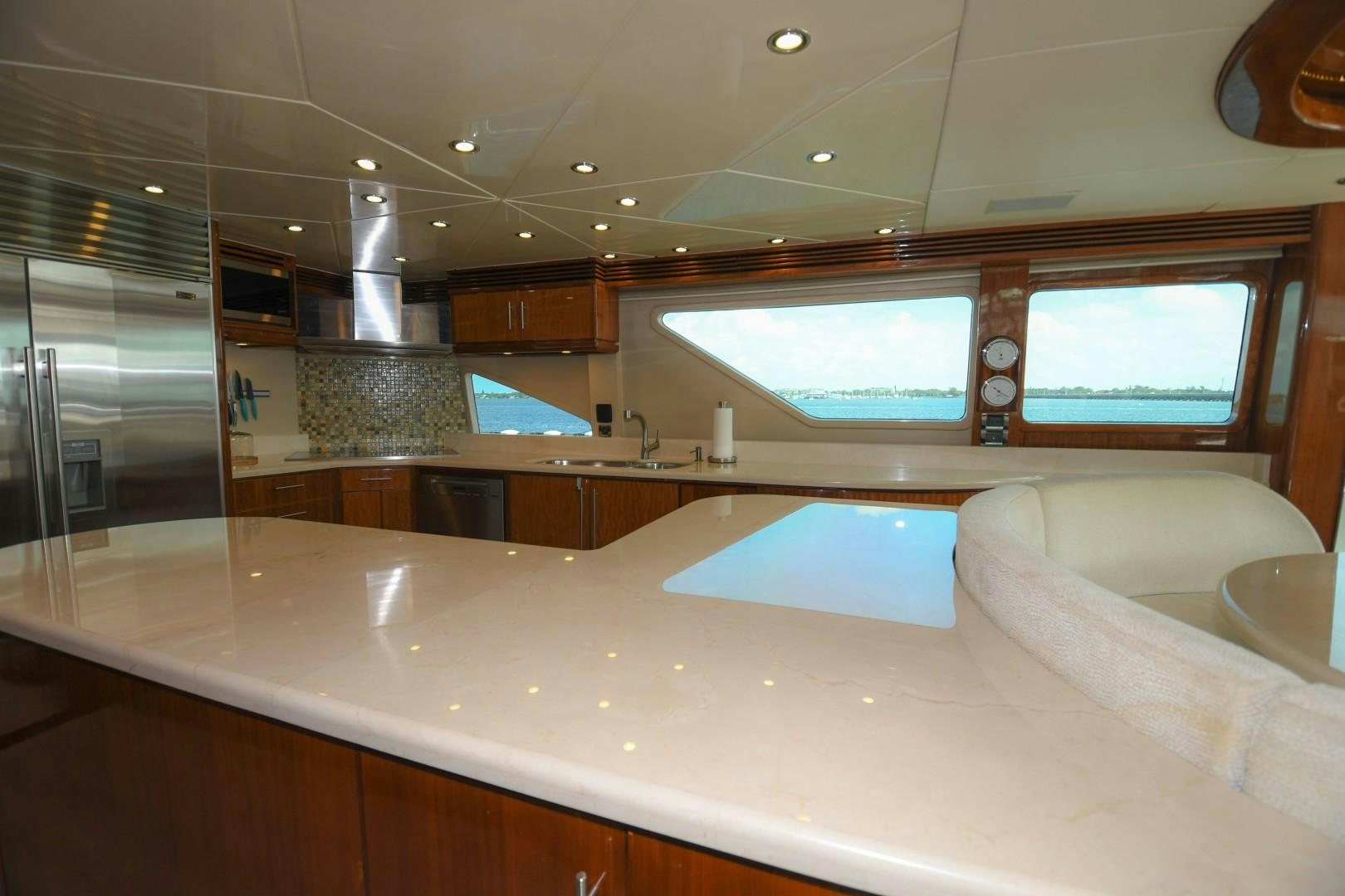 a large kitchen with a large window aboard WARHORSE Yacht for Sale