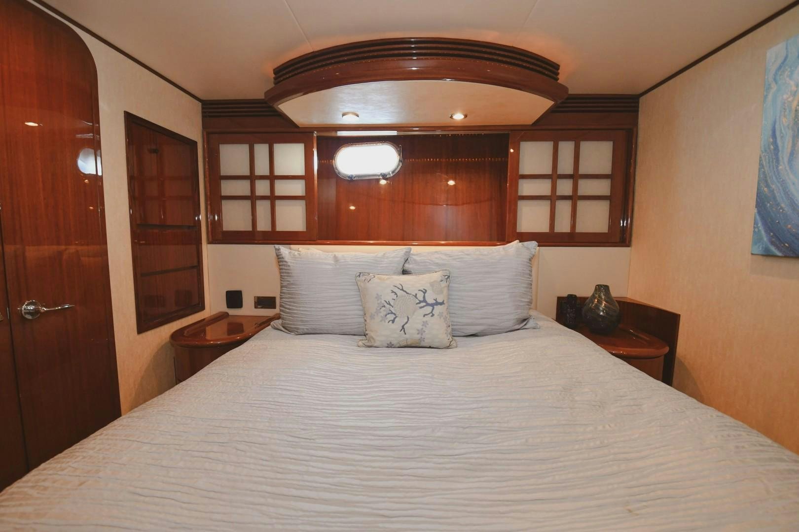 a bed with white sheets aboard WARHORSE Yacht for Sale