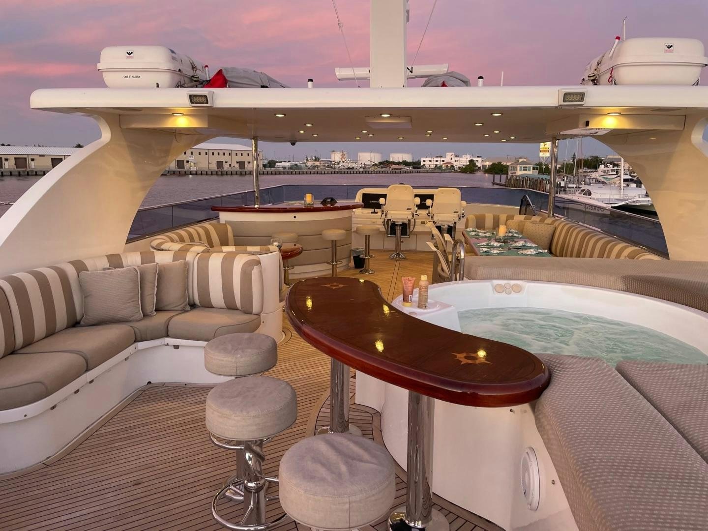 a room with a couch and a table and chairs aboard WARHORSE Yacht for Sale