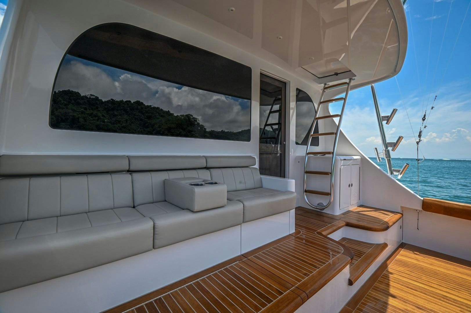 a white couch in a room aboard Fish Tank Yacht for Sale