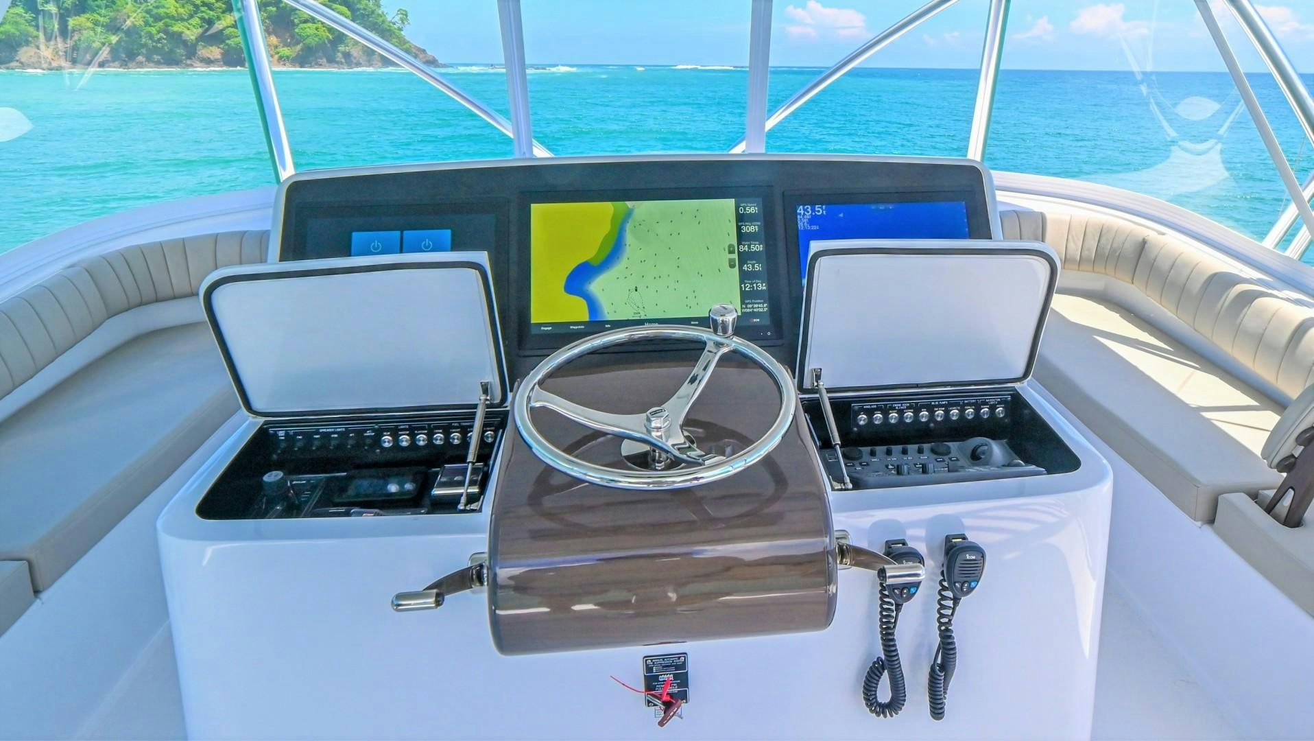 a group of laptops on a boat aboard Fish Tank Yacht for Sale