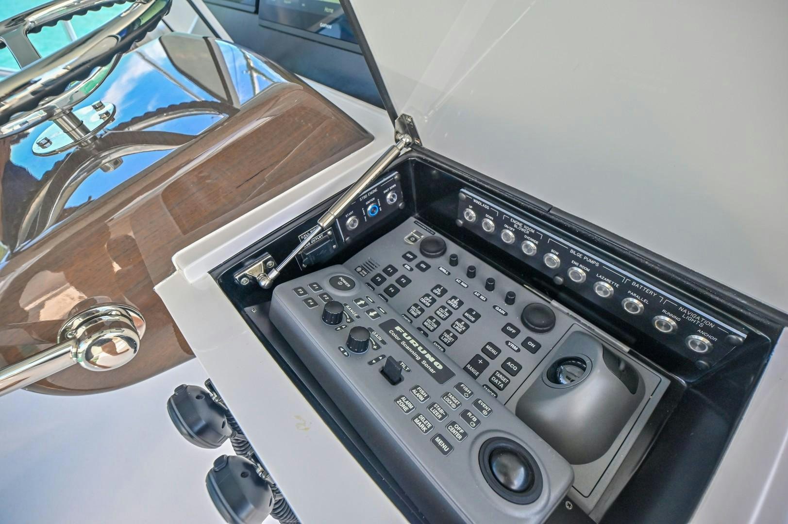 a car stereo with a keypad aboard Fish Tank Yacht for Sale