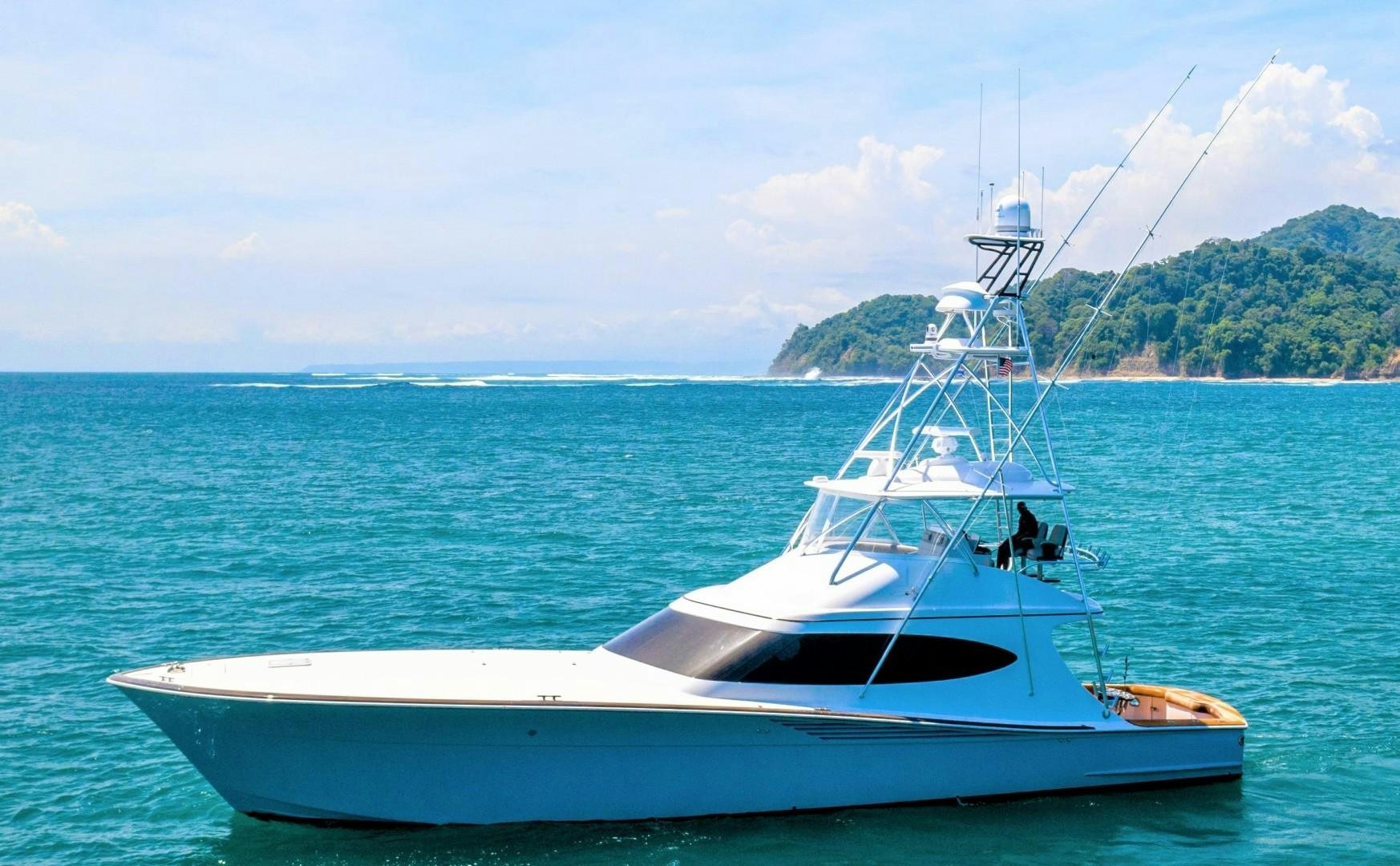 a white boat in the water aboard Fish Tank Yacht for Sale
