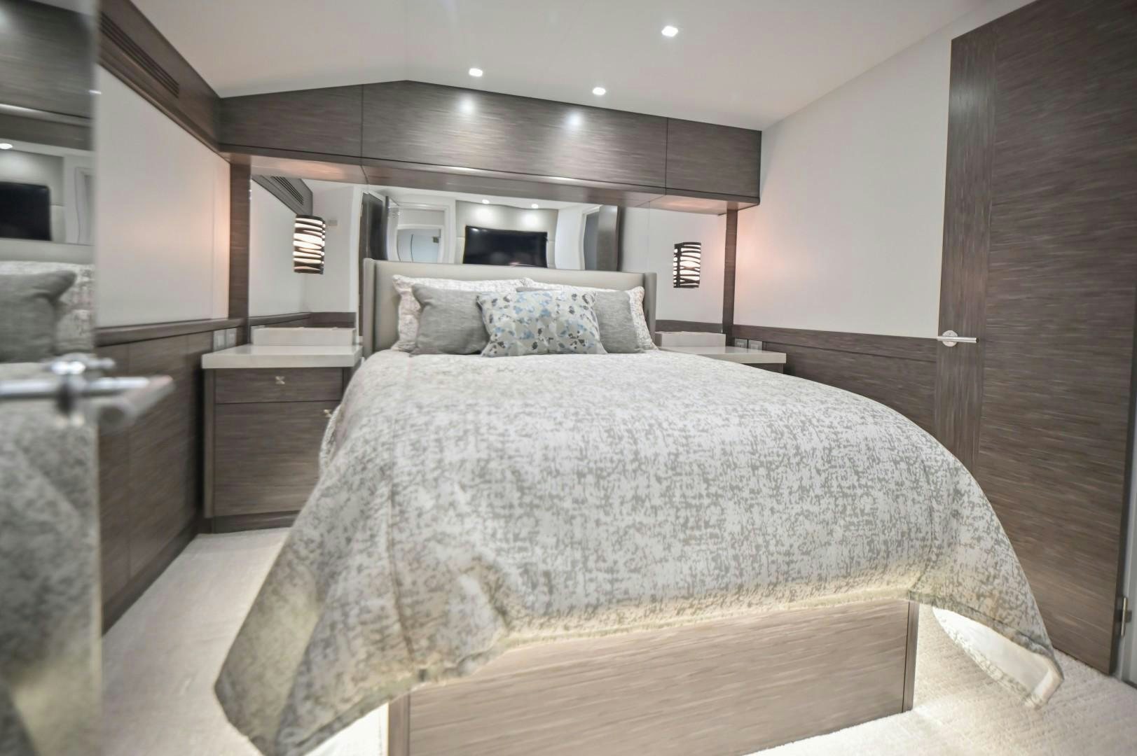 a bed in a room aboard Fish Tank Yacht for Sale