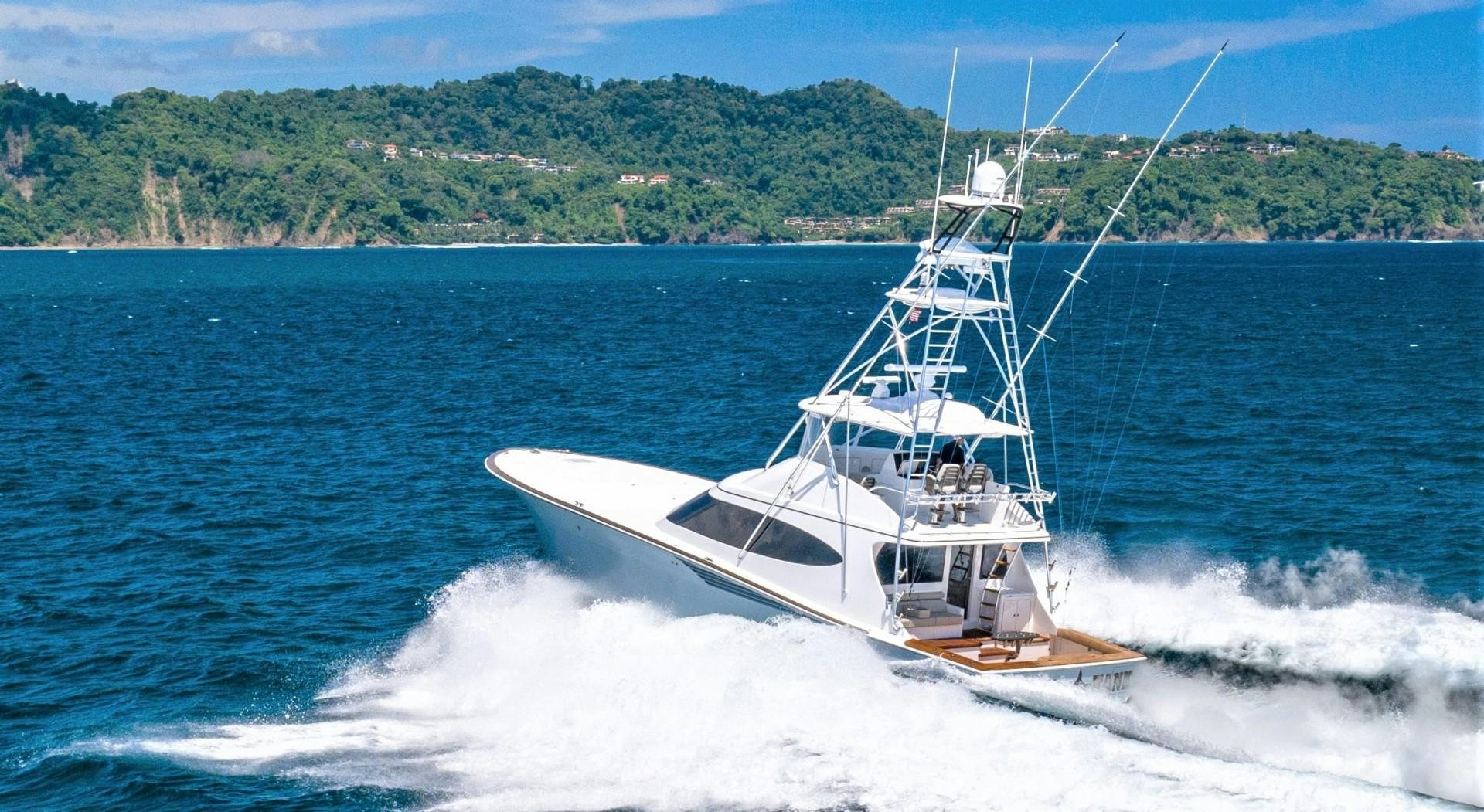 a boat on the water aboard Fish Tank Yacht for Sale