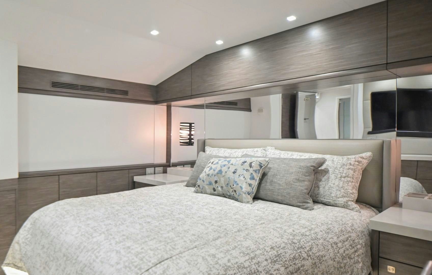 a large bed in a room aboard Fish Tank Yacht for Sale