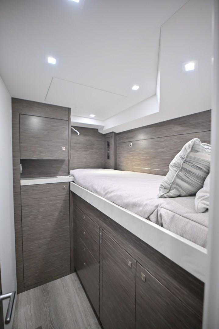 a bed in a room aboard Fish Tank Yacht for Sale