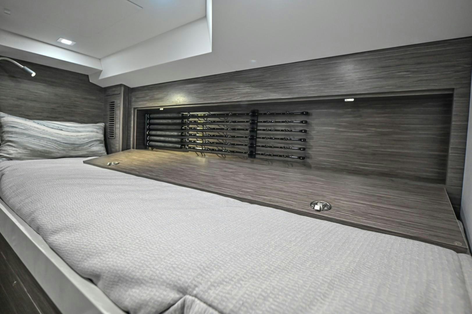 a bed with a white sheet aboard Fish Tank Yacht for Sale