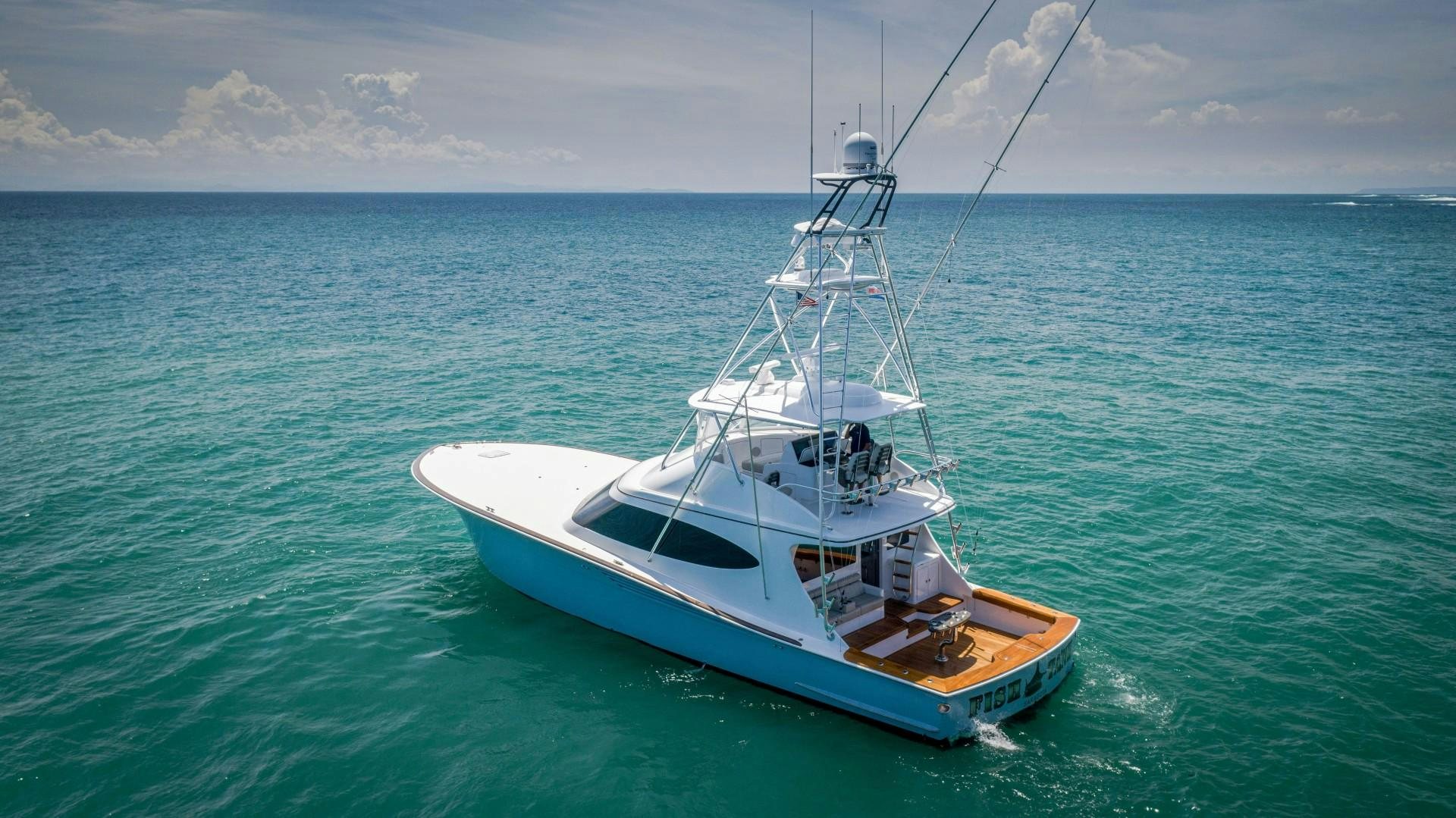 a boat in the water aboard Fish Tank Yacht for Sale