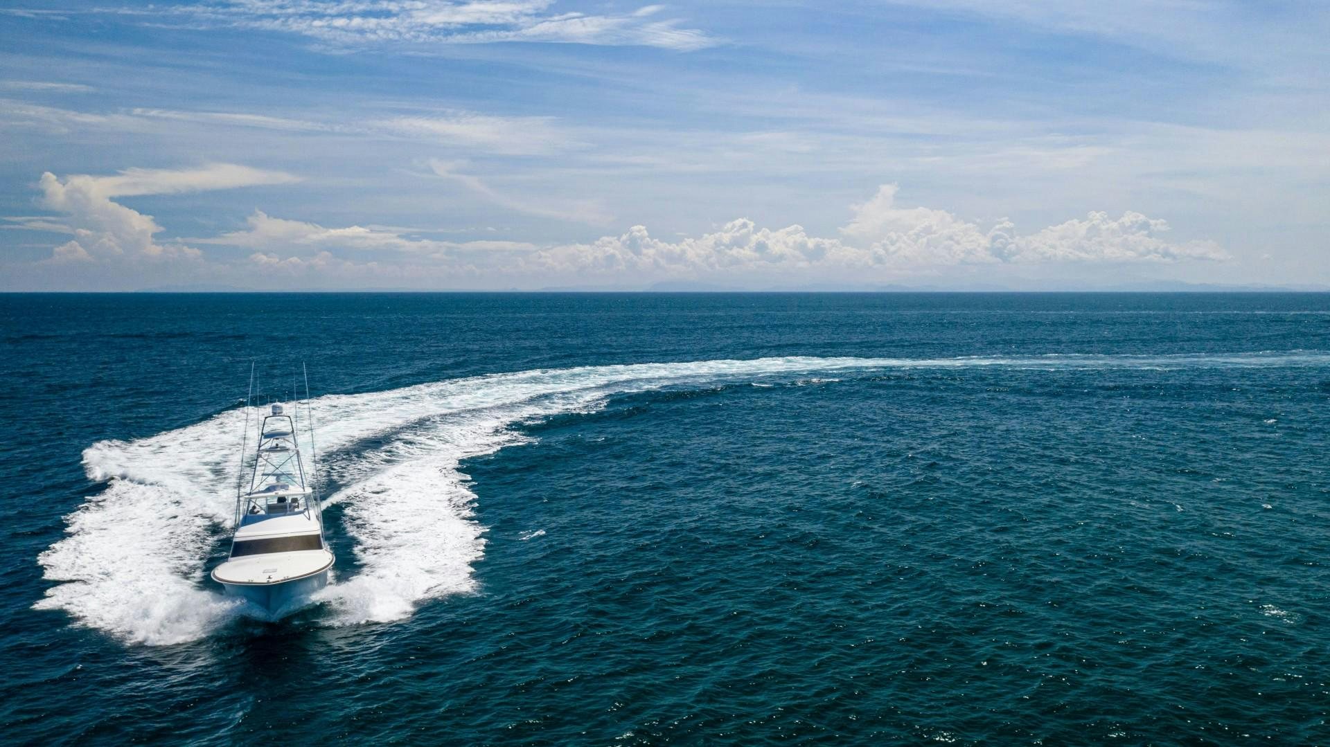 a boat sailing on the sea aboard Fish Tank Yacht for Sale