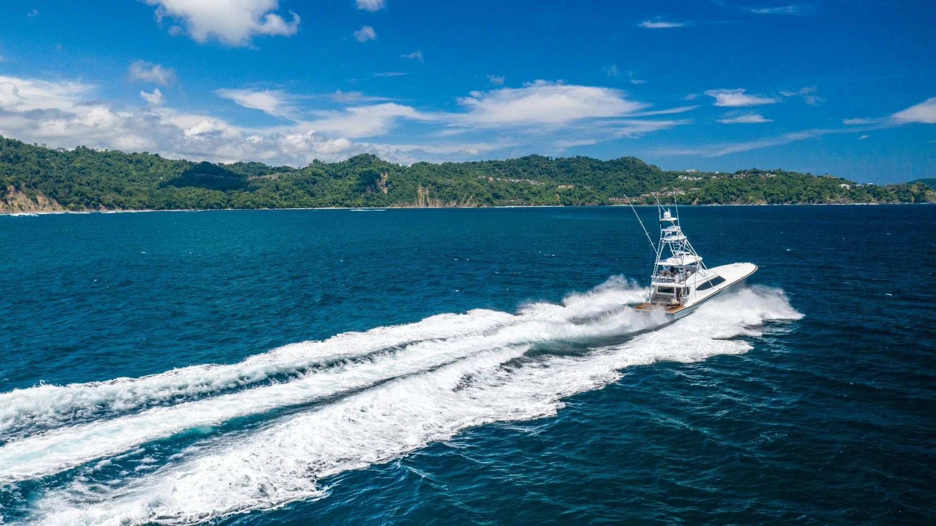 a boat on the water aboard Fish Tank Yacht for Sale