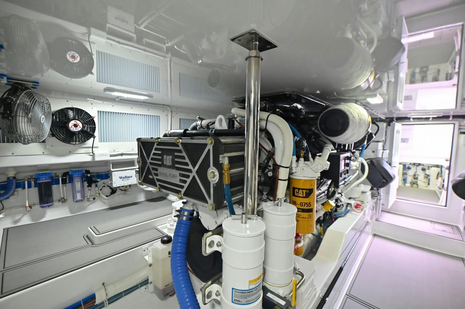 a white machine with a large white object in it aboard Fish Tank Yacht for Sale