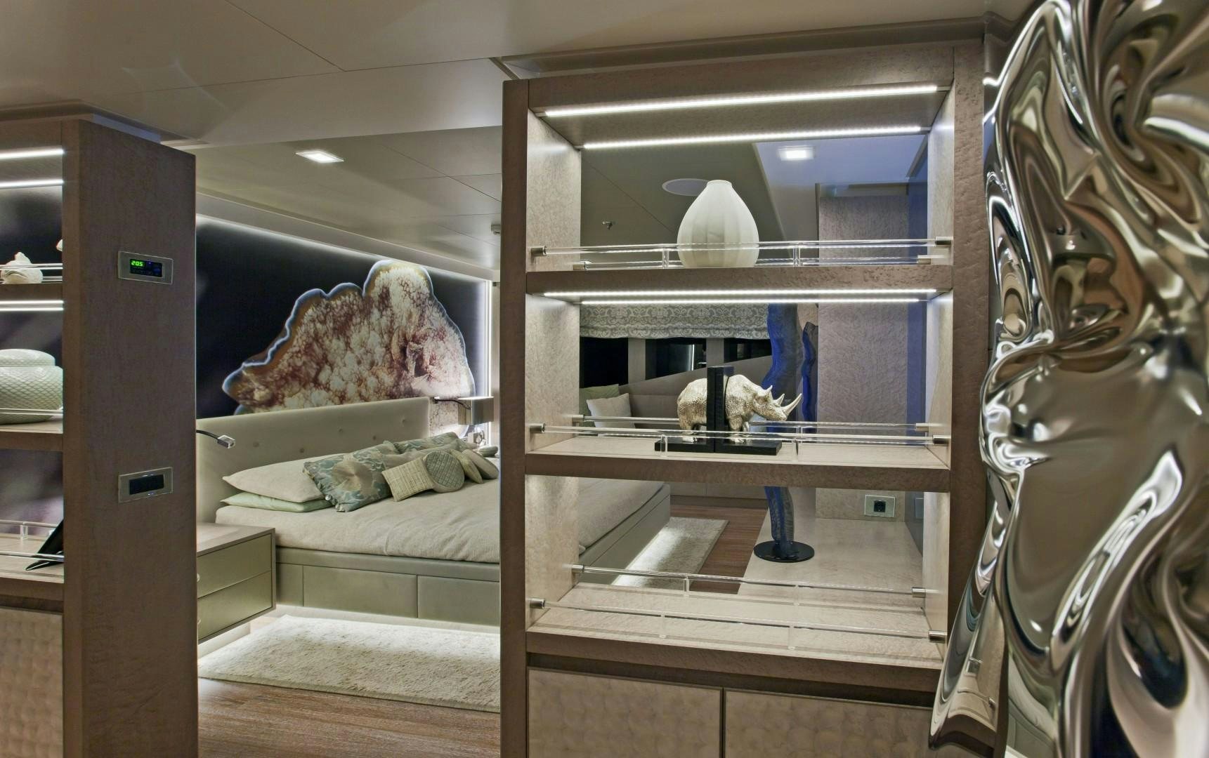 a person in a room with a cat in a mirror aboard LIBERTY Yacht for Sale