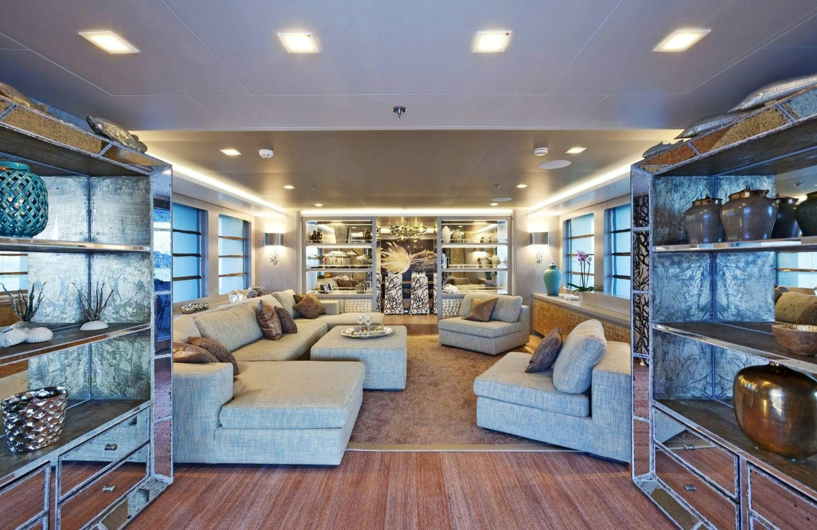 a living room with a large glass window aboard LIBERTY Yacht for Sale