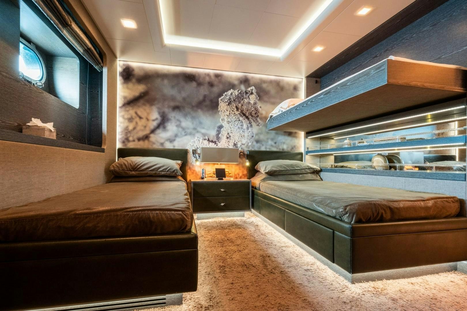 a room with a bed and a tv aboard LIBERTY Yacht for Sale