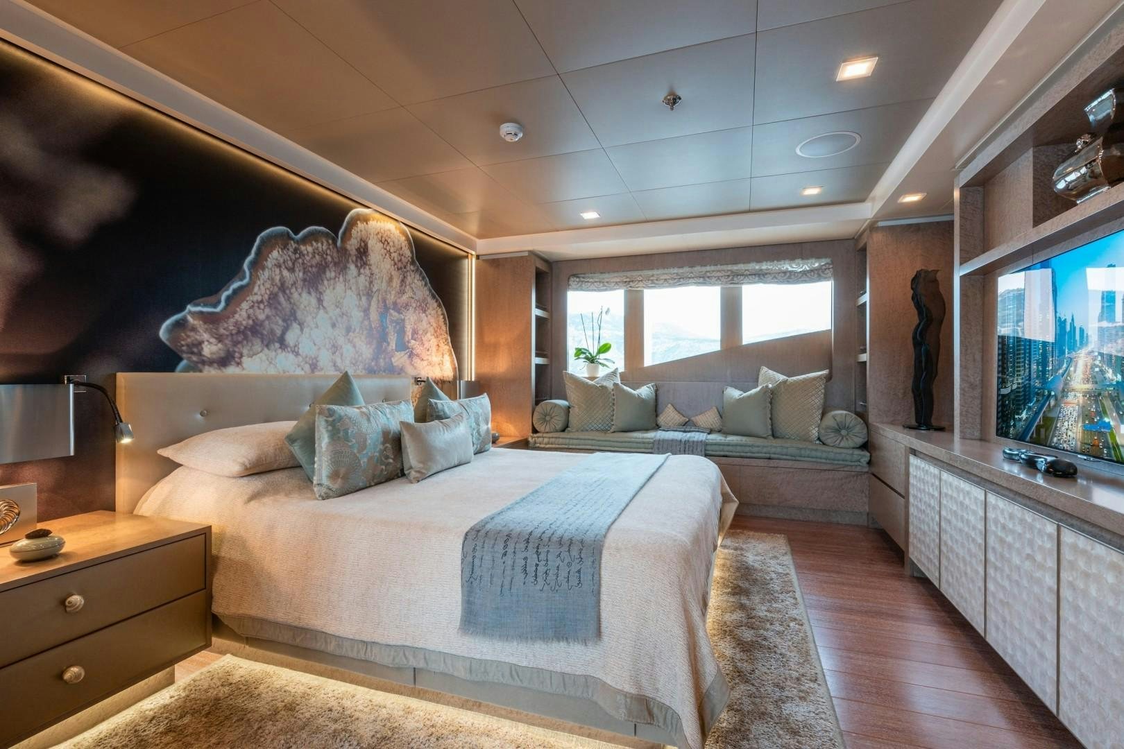 a bedroom with a large bed aboard LIBERTY Yacht for Sale