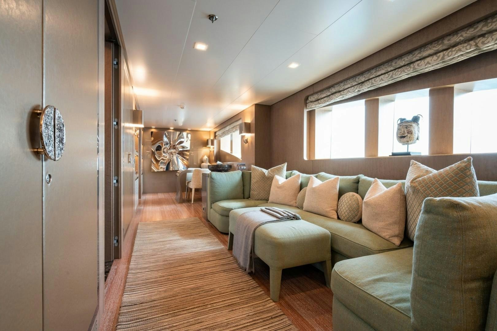 a living room with a couch and a table aboard LIBERTY Yacht for Sale