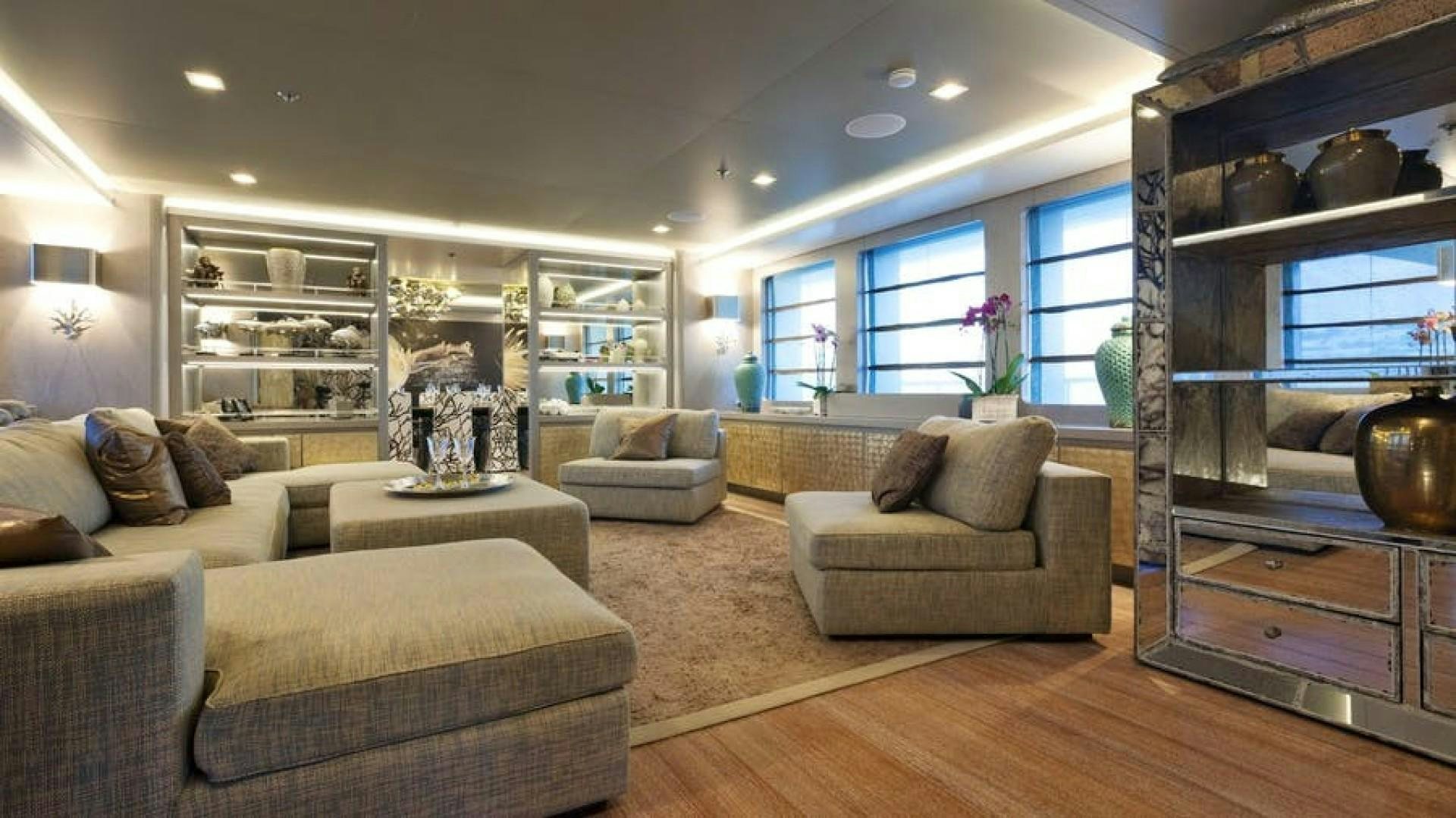 a living room with a large glass window aboard LIBERTY Yacht for Sale