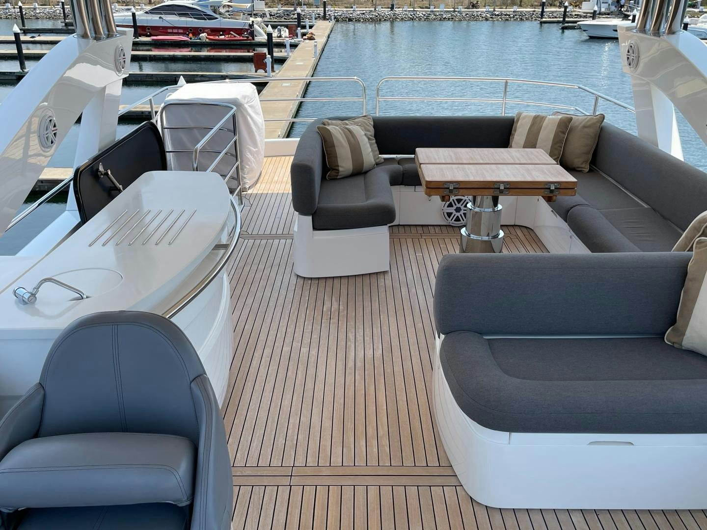 a room with a couch and a table and chairs aboard TRAINERA Yacht for Sale