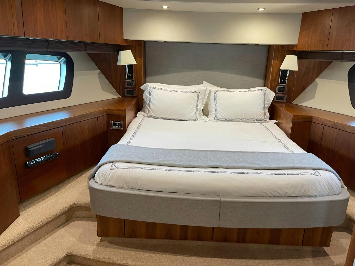 a bed with white sheets aboard TRAINERA Yacht for Sale