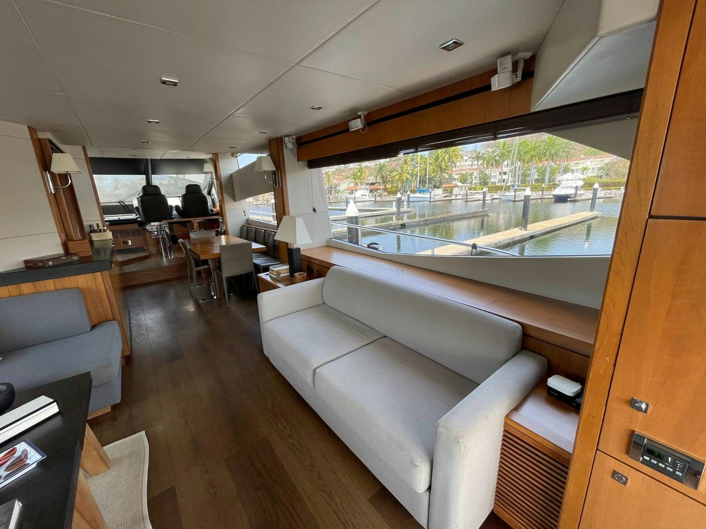 a living room with a large window aboard TRAINERA Yacht for Sale