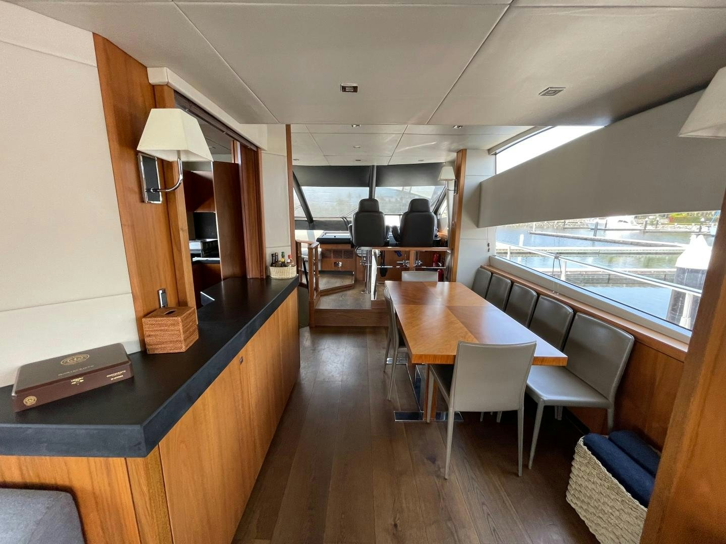 a room with a table and chairs aboard TRAINERA Yacht for Sale