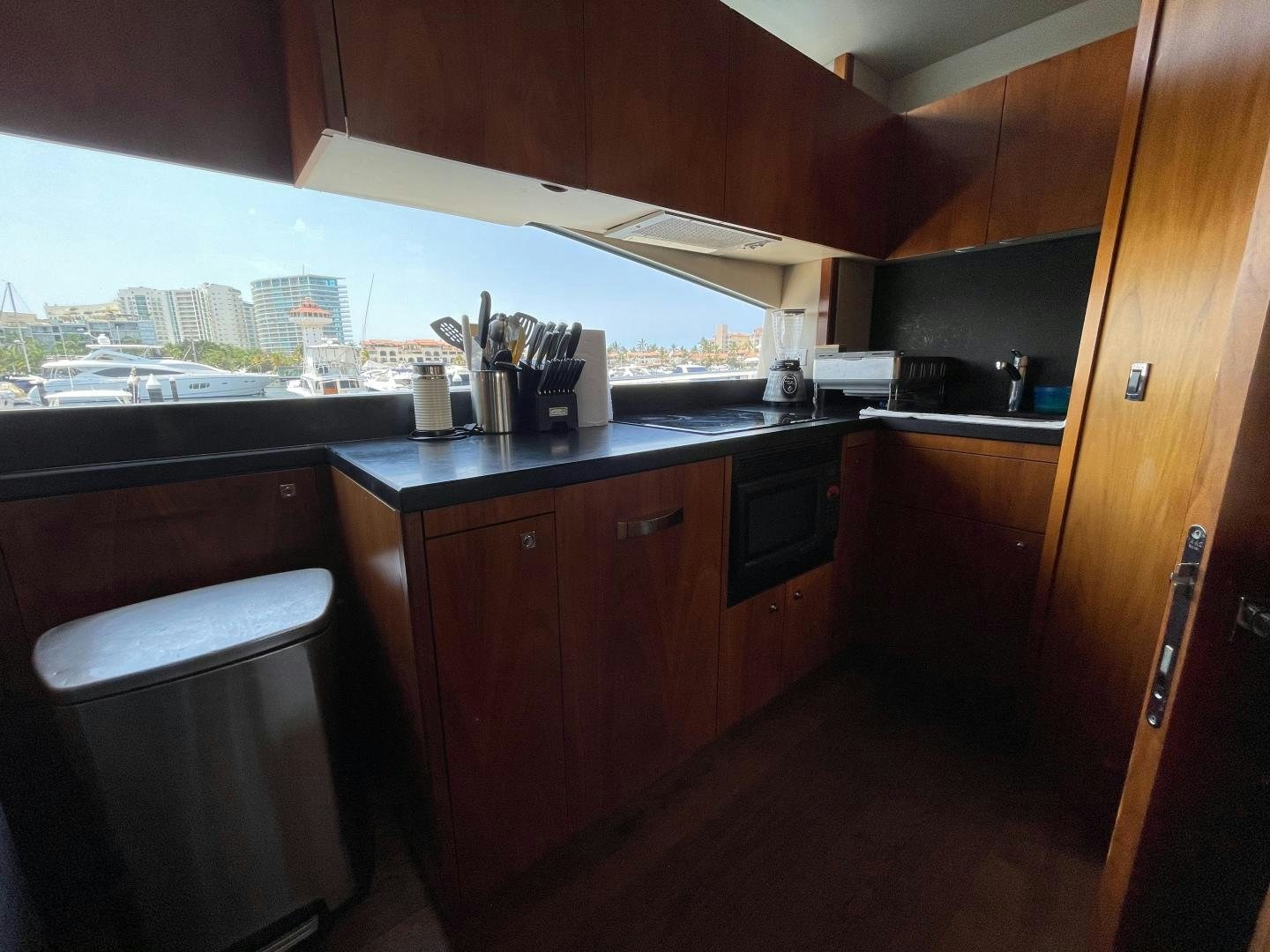 a kitchen with a window aboard TRAINERA Yacht for Sale