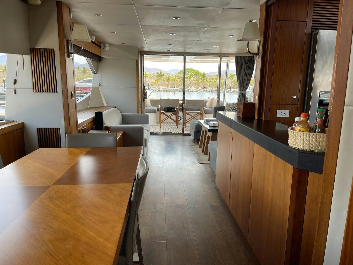a room with a table and chairs aboard TRAINERA Yacht for Sale