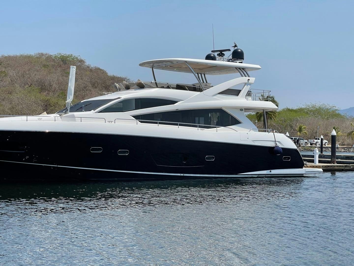 a boat docked at a pier aboard TRAINERA Yacht for Sale