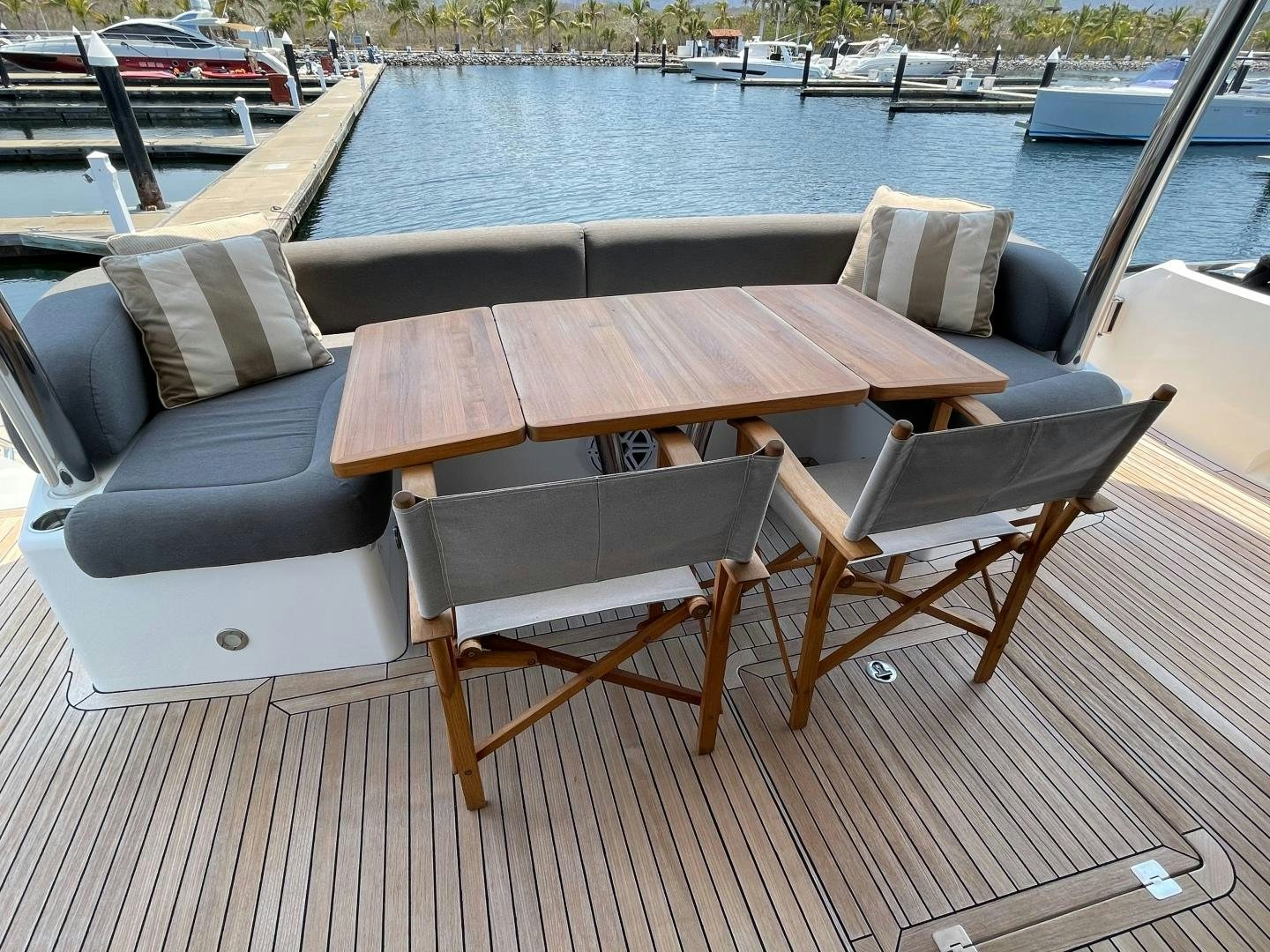 a table and chairs on a deck aboard TRAINERA Yacht for Sale