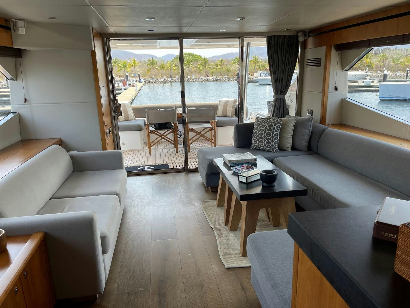 a living room with a large window aboard TRAINERA Yacht for Sale