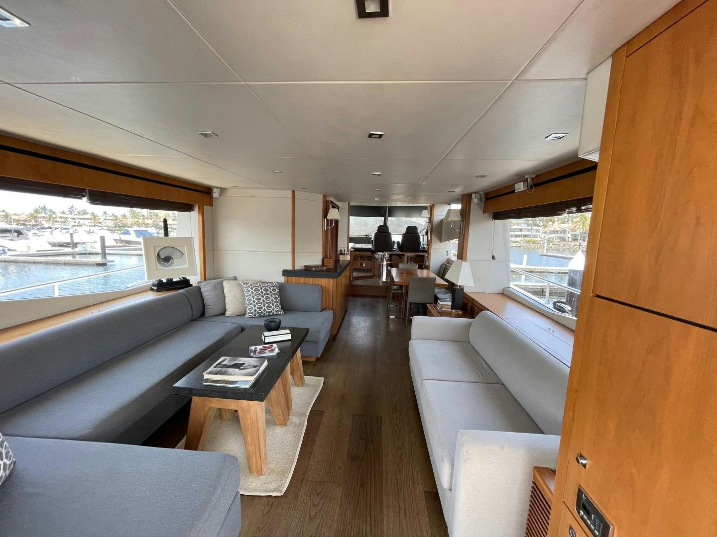 a living room with a large window aboard TRAINERA Yacht for Sale