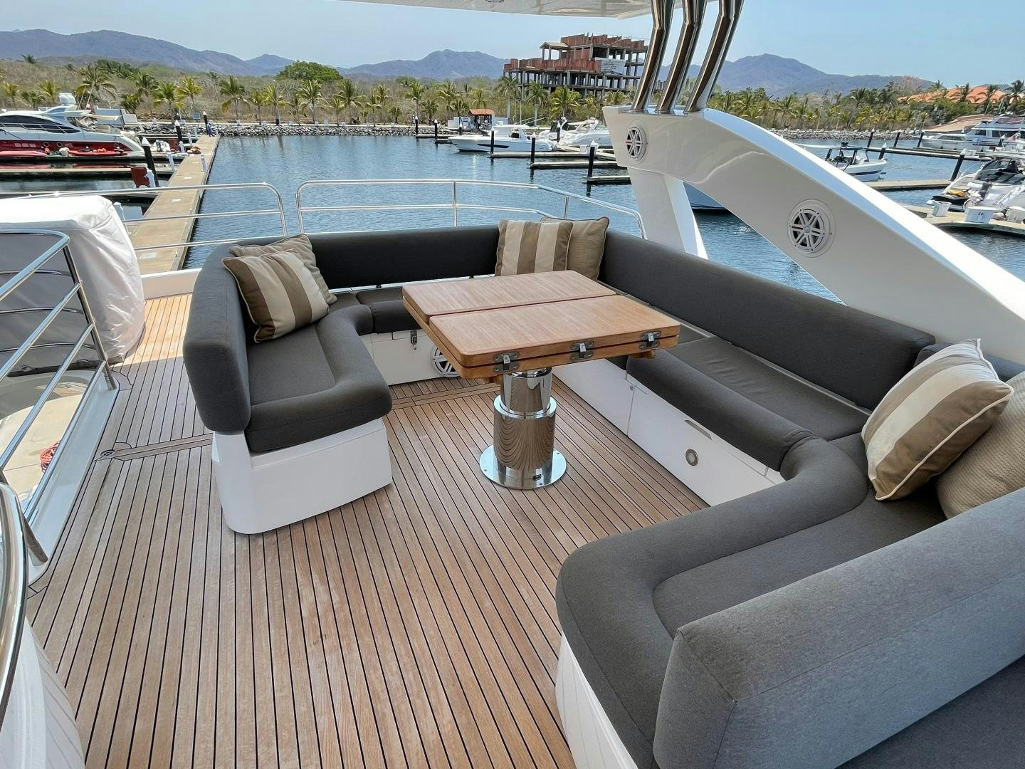 a living room with a couch and a table aboard TRAINERA Yacht for Sale