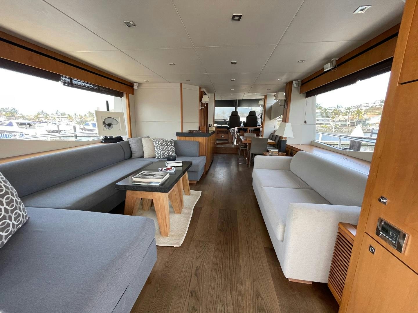 a living room with a large window aboard TRAINERA Yacht for Sale