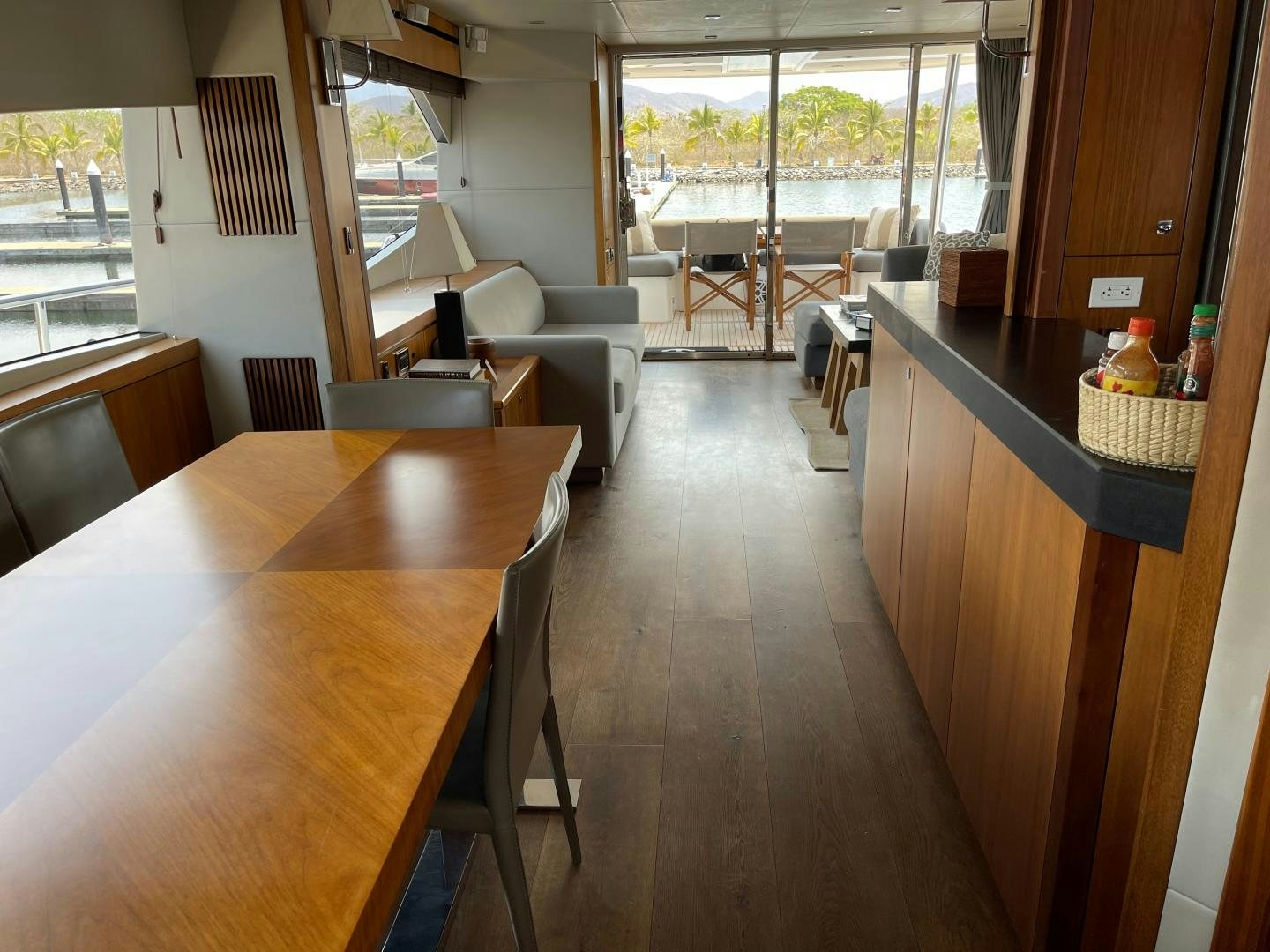 a kitchen and dining area aboard TRAINERA Yacht for Sale
