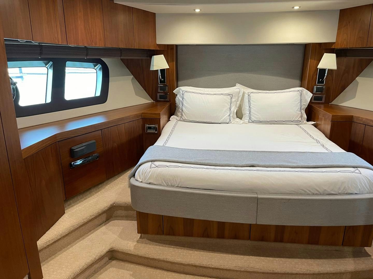 a room with a bed and a television aboard TRAINERA Yacht for Sale