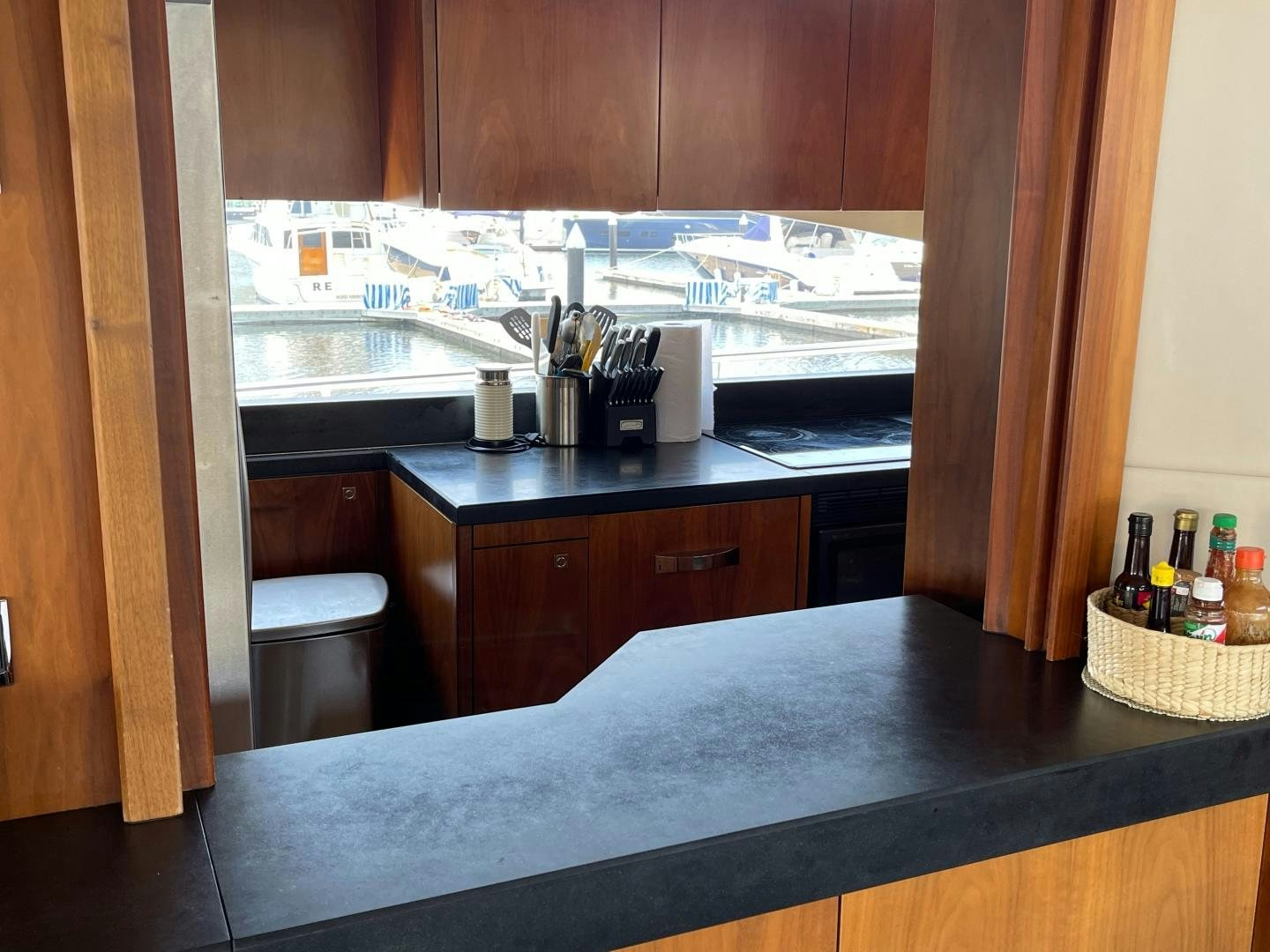 a kitchen with a sink and a window aboard TRAINERA Yacht for Sale