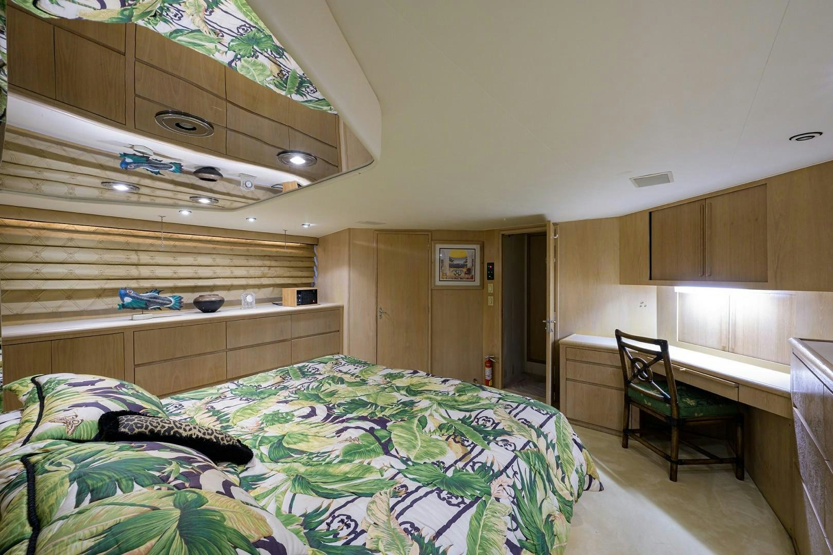 a bedroom with a bunk bed and desk aboard GYPSY ROSE Yacht for Sale
