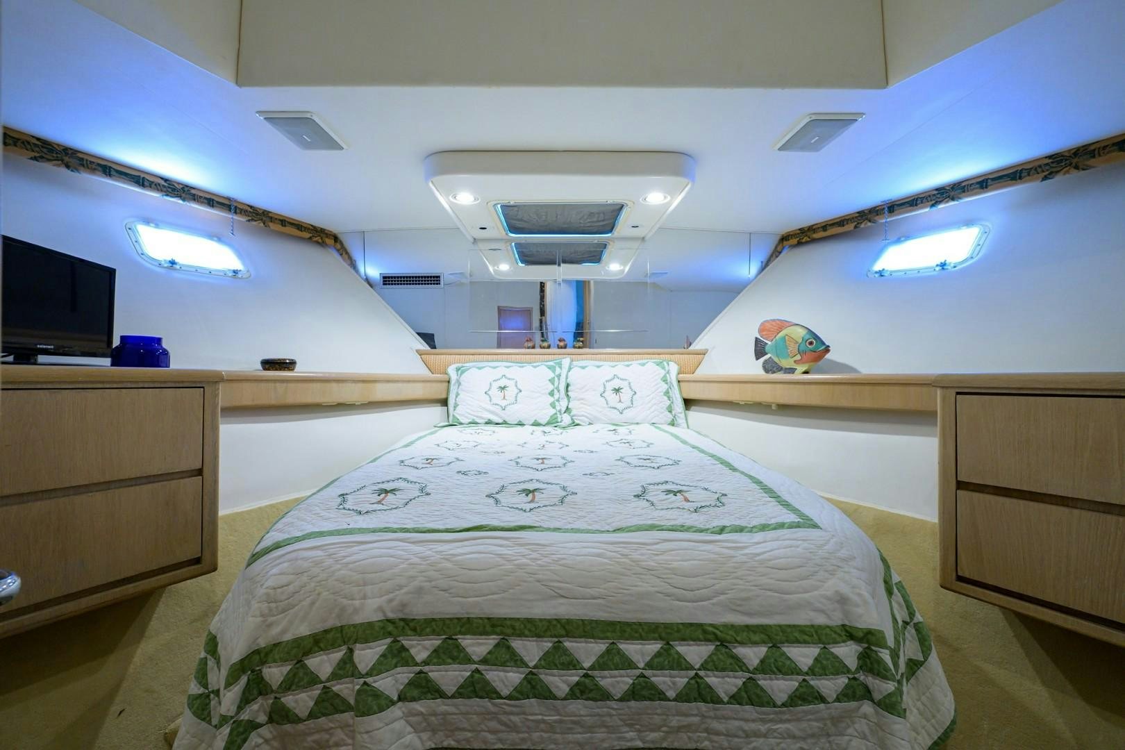 a bedroom with a bed aboard GYPSY ROSE Yacht for Sale