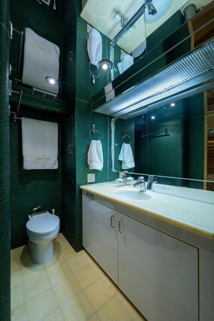 a bathroom with a toilet and a sink aboard GYPSY ROSE Yacht for Sale
