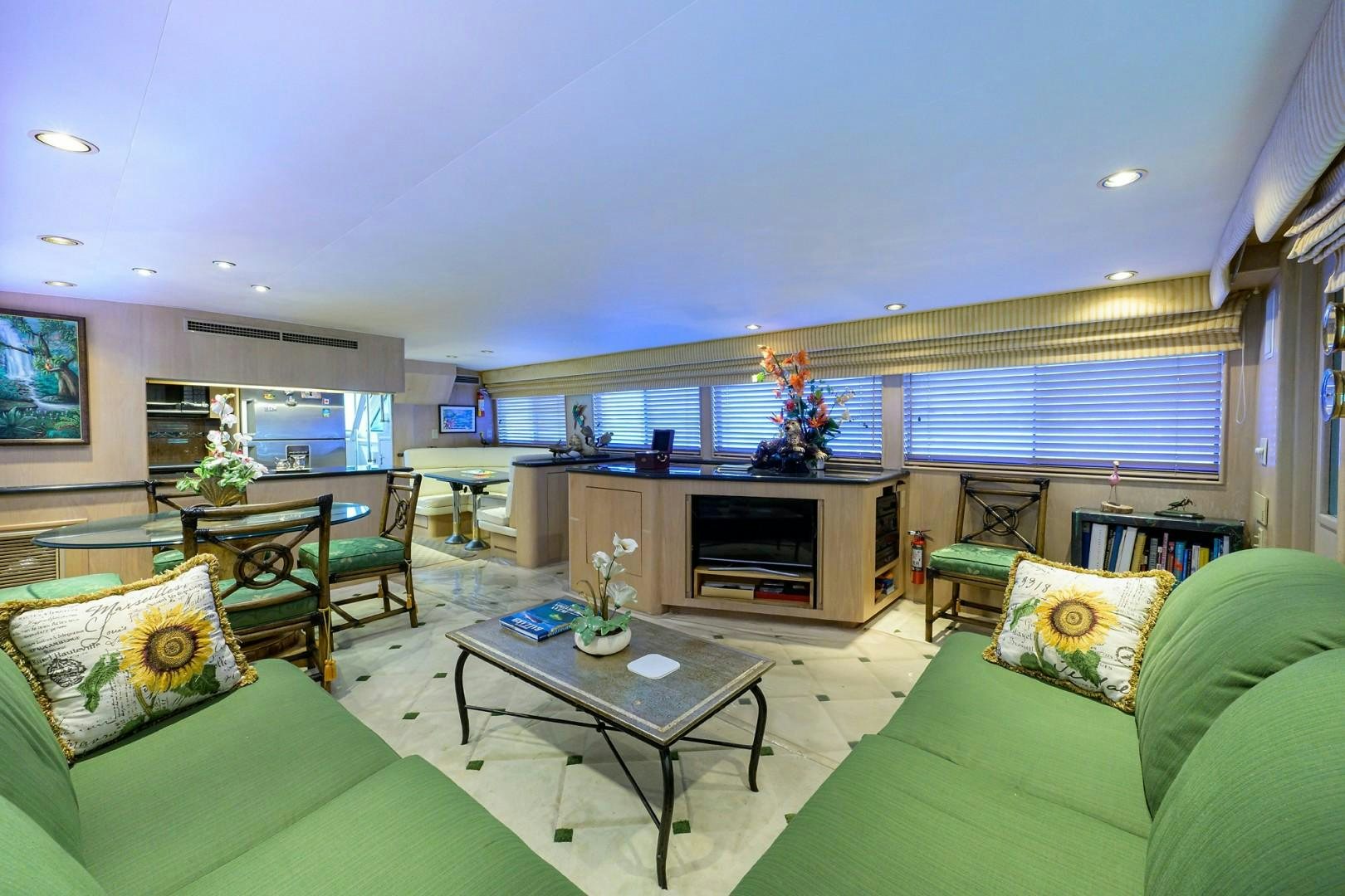 a living room with a fireplace aboard GYPSY ROSE Yacht for Sale