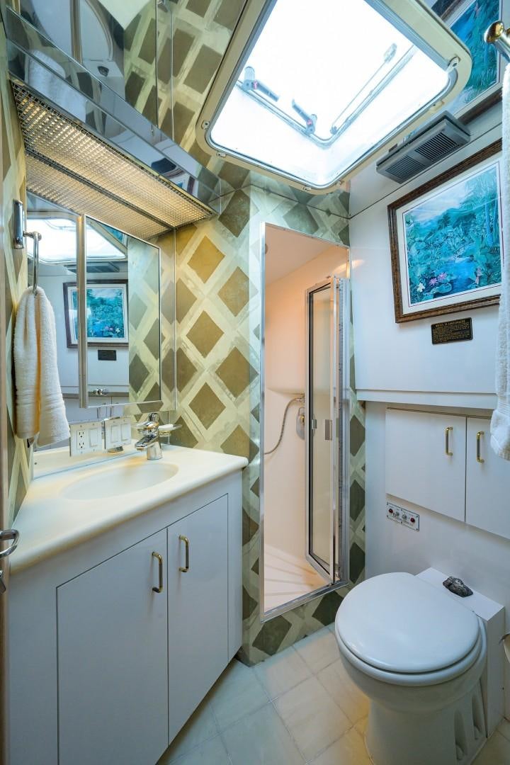 a bathroom with a toilet and sink aboard GYPSY ROSE Yacht for Sale